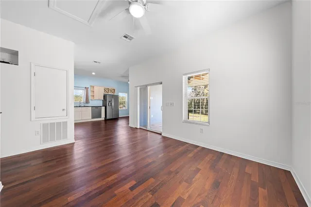 a kitchen with stainless steel appliances granite countertop a sink and a stove