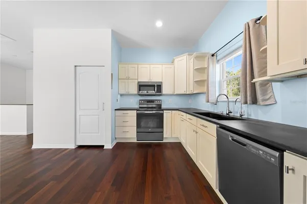 a swimming pool with outdoor seating and yard