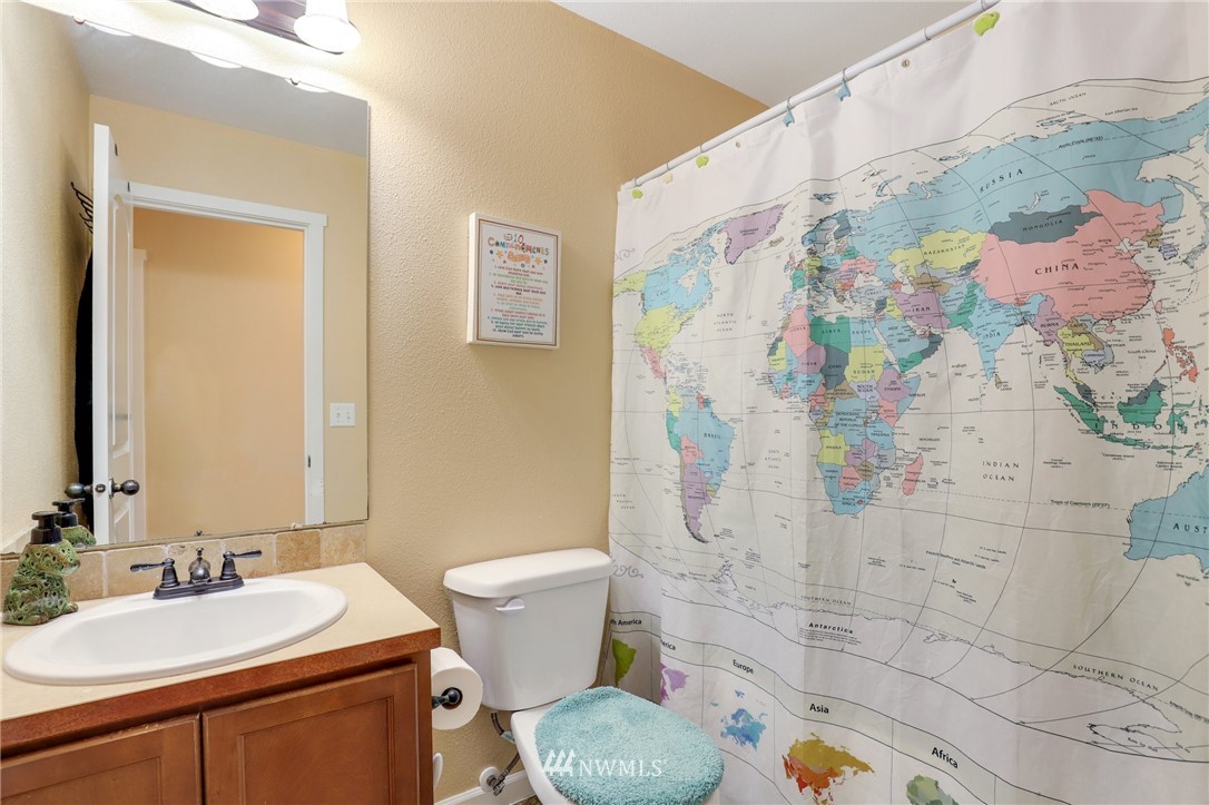5433 66th Way Southeast Lacey, WA 98513 - Photo 13 of 20 a bathroom with a sink toilet and shower