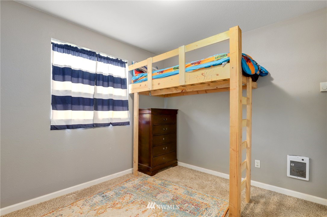 5433 66th Way Southeast Lacey, WA 98513 - Photo 14 of 20 a view of room with window and refrigerator