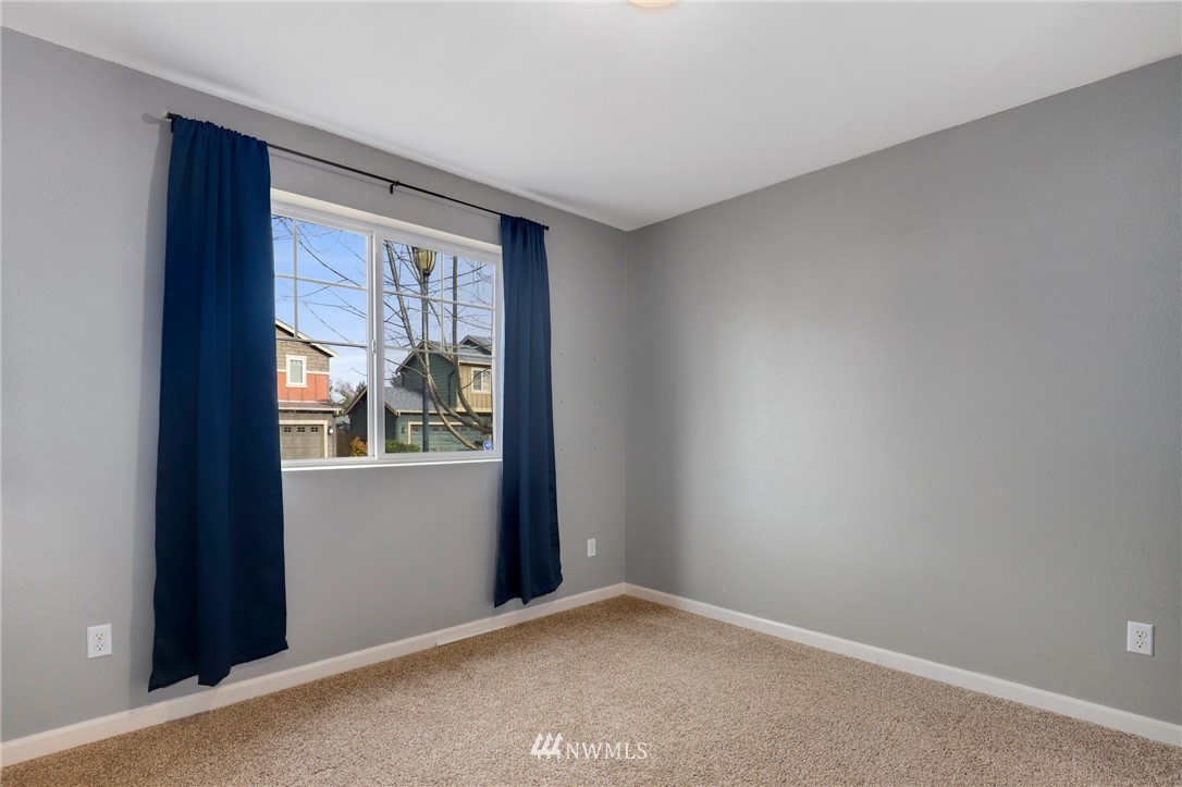 5433 66th Way Southeast Lacey, WA 98513 - Photo 5 of 20 a view of an empty room with window