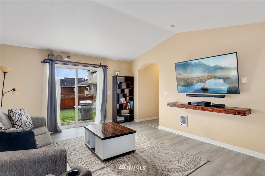 5433 66th Way Southeast Lacey, WA 98513 - Photo 7 of 20 a living room with furniture and a flat screen tv