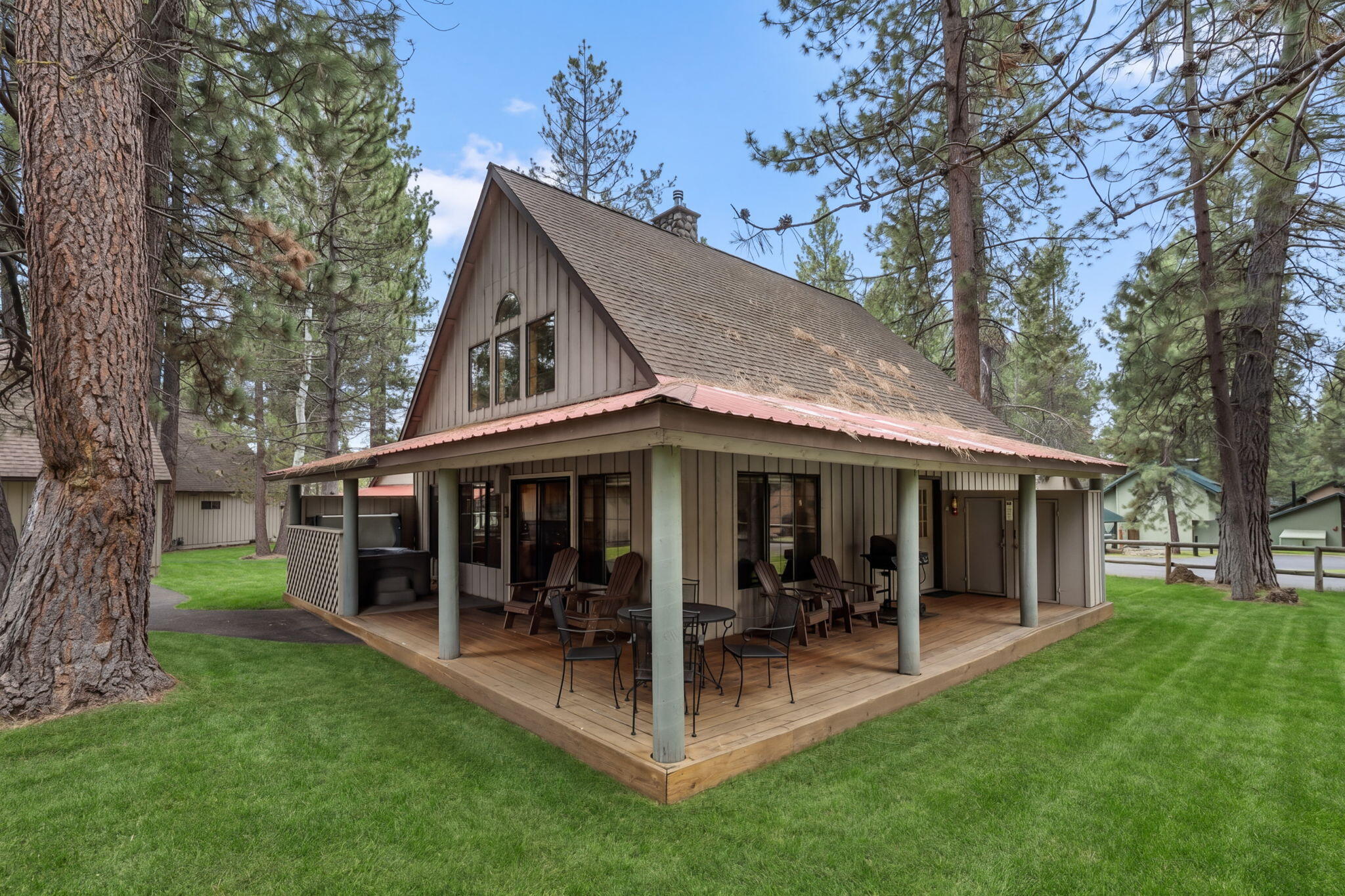 57505 Circle 4 Cabin Road, Unit 29 Sunriver, OR 97707 - Photo 1 of 35 a view of a chair and table in backyard of the house
