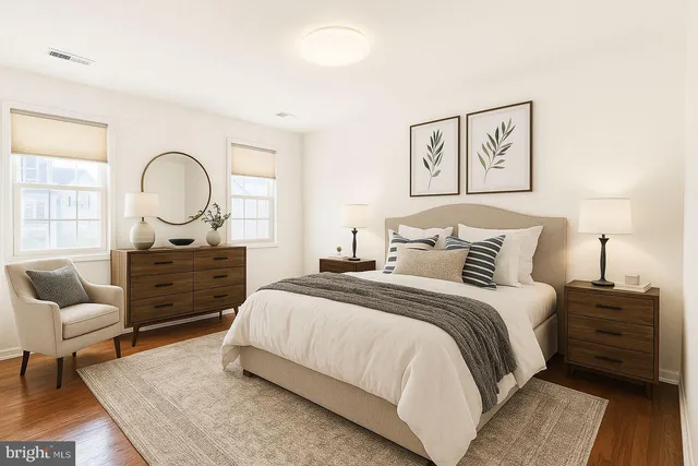 a spacious bedroom with a bed and a couch