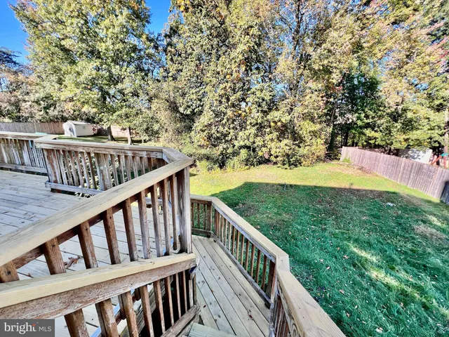 a front view of a house with yard and garage