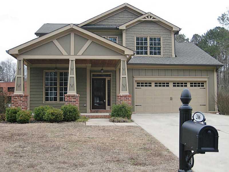 266 Old Canton Road Ball Ground, GA 30107 - Photo 1 of 1 Exterior Front. What Curb Appeal! Shingle Siding & Brick Based Craftsman-Style Columns Accent the Large Front Porch