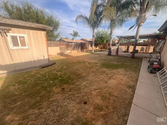 a view of swimming pool with a yard