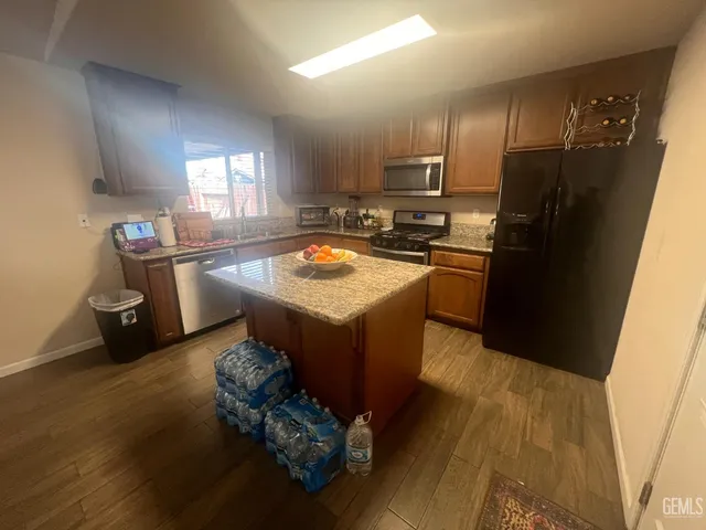 a kitchen with a sink appliances and cabinets