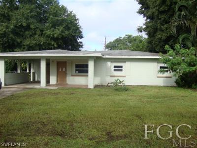 2301 Lotus Road Fort Myers, FL 33905 - Photo 1 of 10 a front view of house with yard