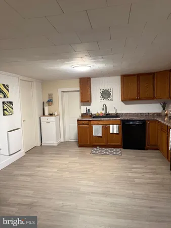 a kitchen with stainless steel appliances granite countertop a stove and a sink