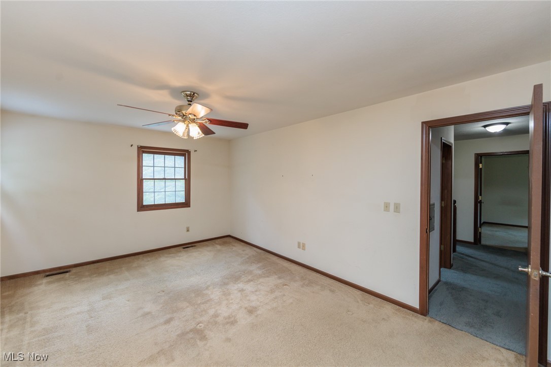 3324 Marsh Road Stow, OH 44224 - Photo 24 of 33 Carpeted empty room with baseboards and ceiling fan