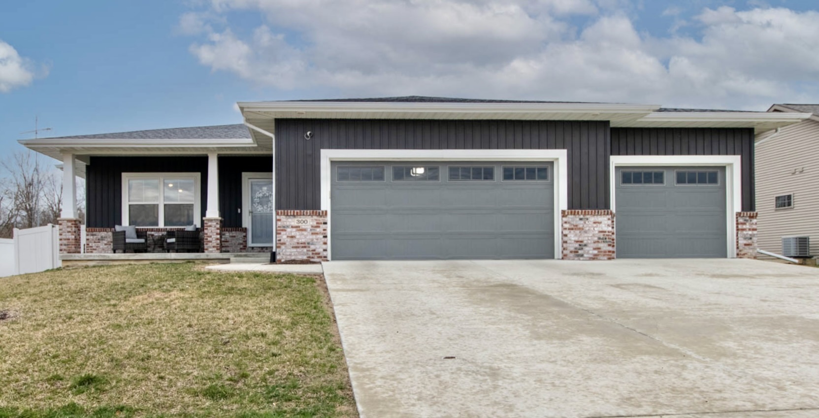 300 Raef Road Downs, IL 61736 - Photo 1 of 47 a front view of a house with a yard and garage
