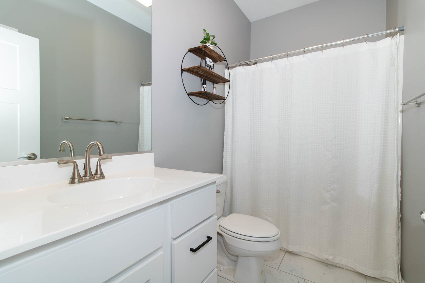 300 Raef Road Downs, IL 61736 - Photo 21 of 47 a bathroom with a sink a toilet and shower