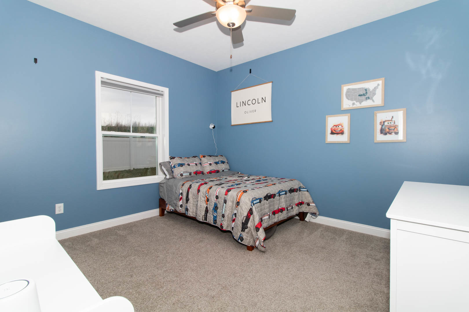 300 Raef Road Downs, IL 61736 - Photo 22 of 47 a bedroom with a bed and a chandelier