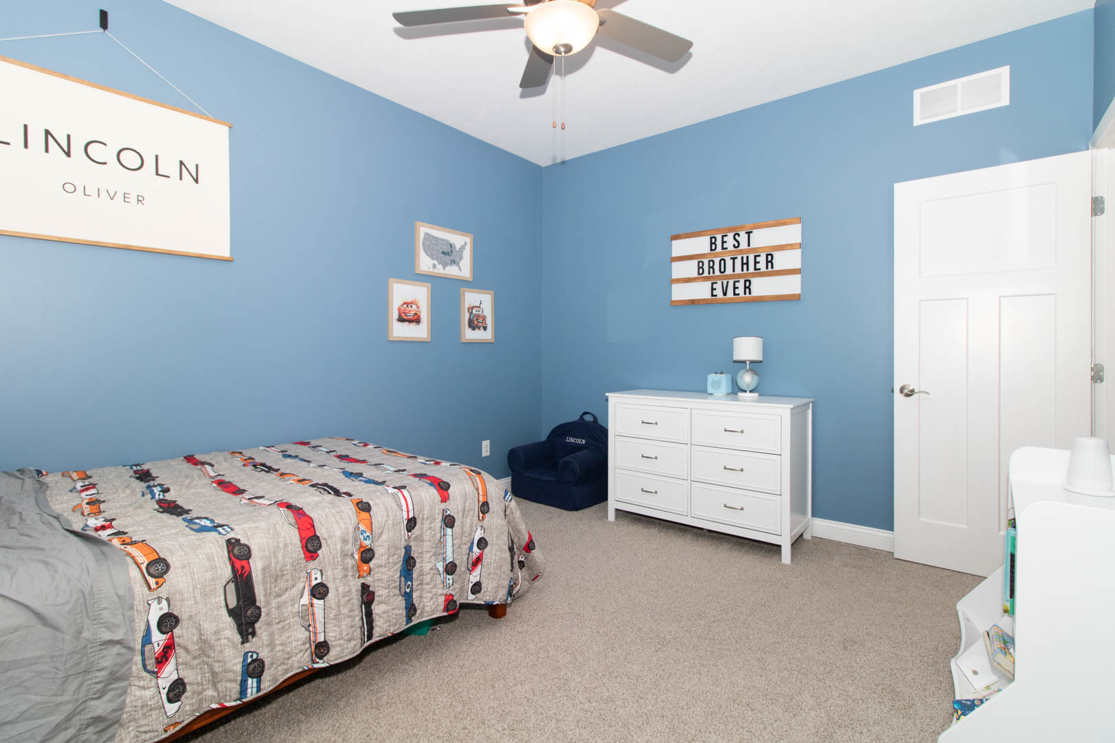 300 Raef Road Downs, IL 61736 - Photo 25 of 47 a bedroom with a bed and a chandelier