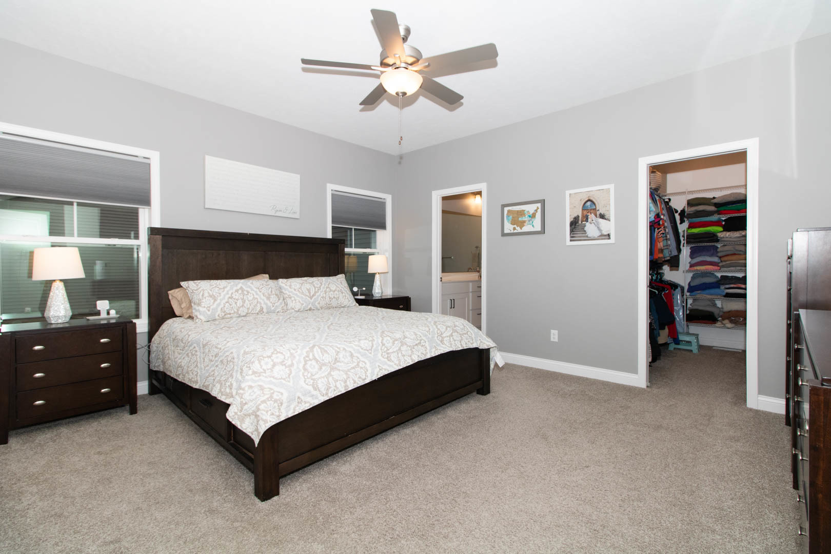 300 Raef Road Downs, IL 61736 - Photo 26 of 47 a bedroom with a bed and a chandelier