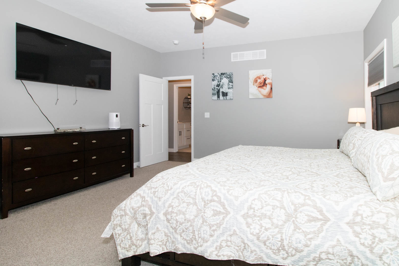 300 Raef Road Downs, IL 61736 - Photo 28 of 47 a bedroom with a bed and a flat screen tv