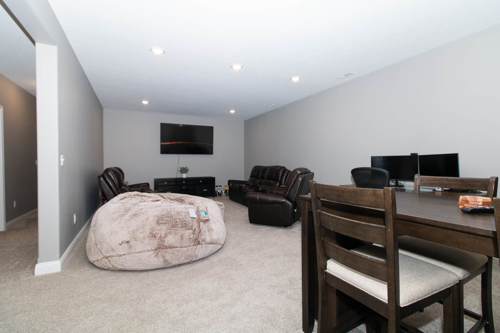 300 Raef Road Downs, IL 61736 - Photo 34 of 47 a living room with furniture and a flat screen tv