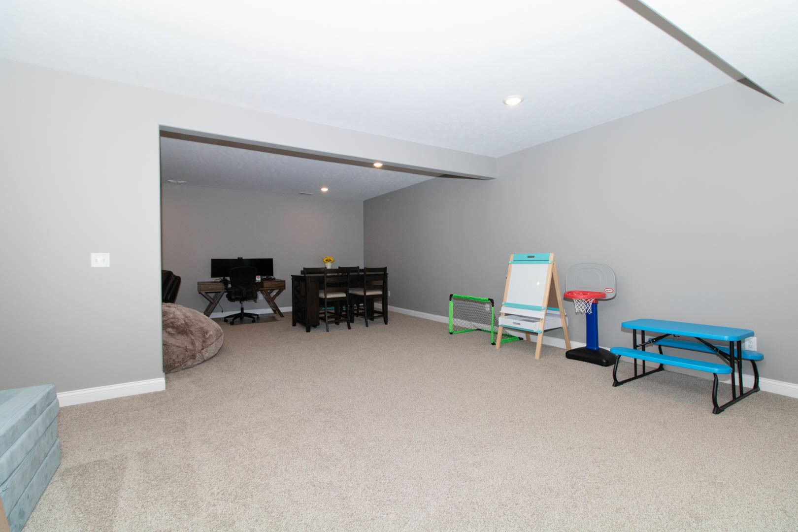 300 Raef Road Downs, IL 61736 - Photo 39 of 47 a playing room with furniture and a flat screen tv