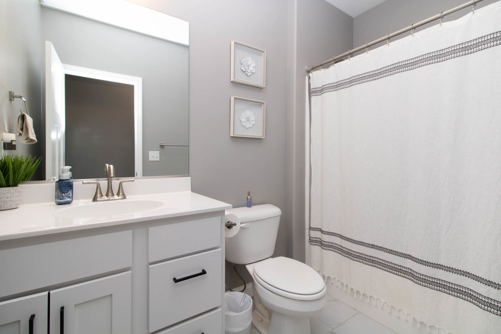 300 Raef Road Downs, IL 61736 - Photo 40 of 47 a bathroom with a granite countertop sink mirror vanity and toilet