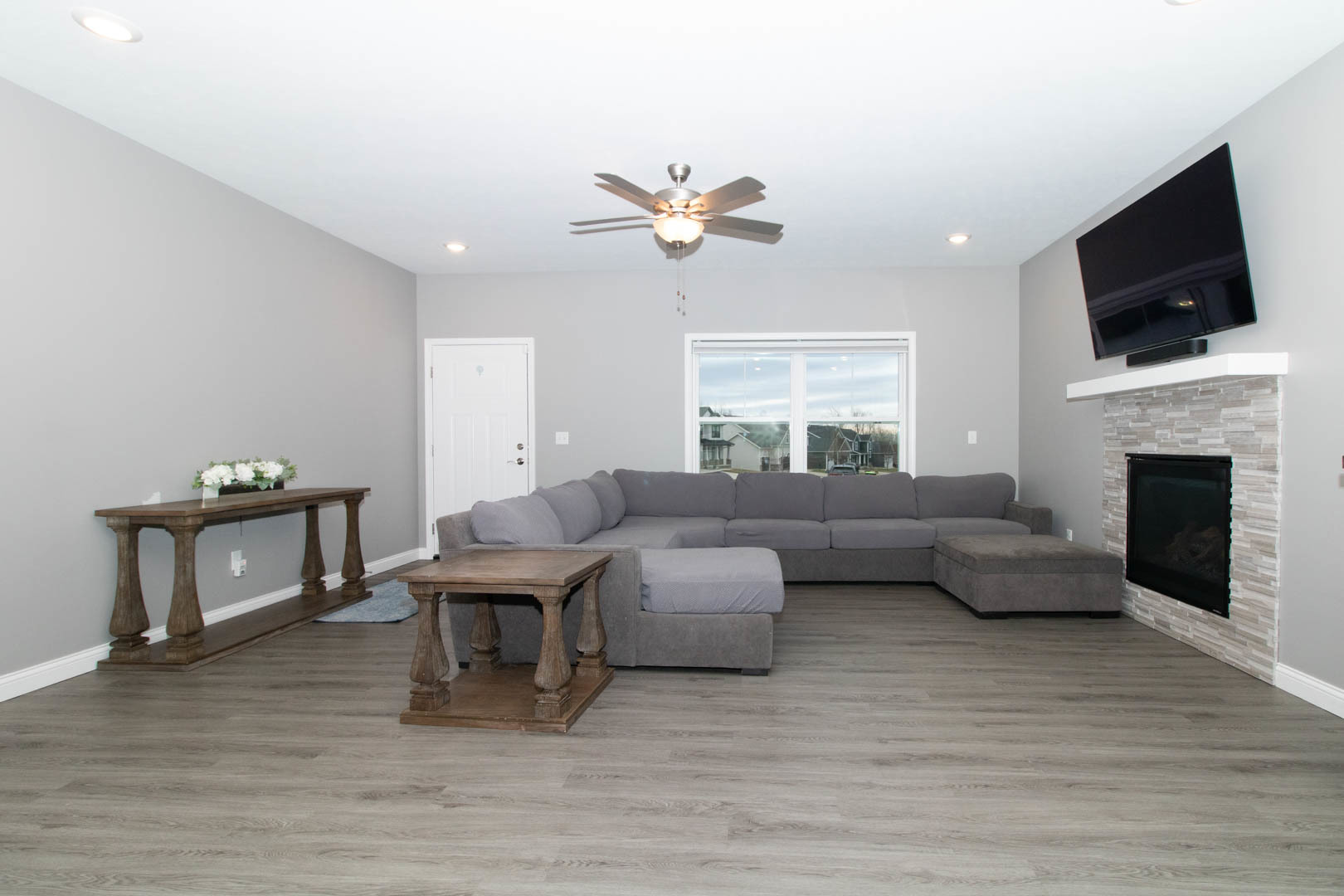 300 Raef Road Downs, IL 61736 - Photo 4 of 47 a living room with furniture fireplace and flat screen tv