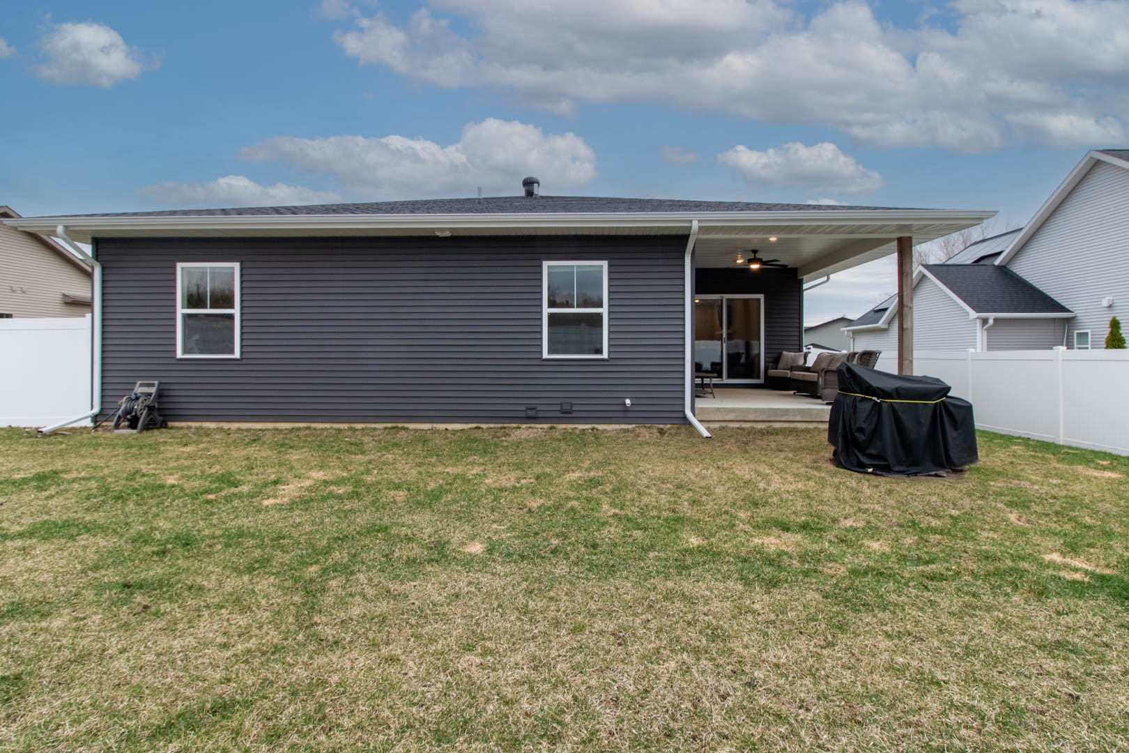 300 Raef Road Downs, IL 61736 - Photo 45 of 47 a backyard of a house with yard table and chairs