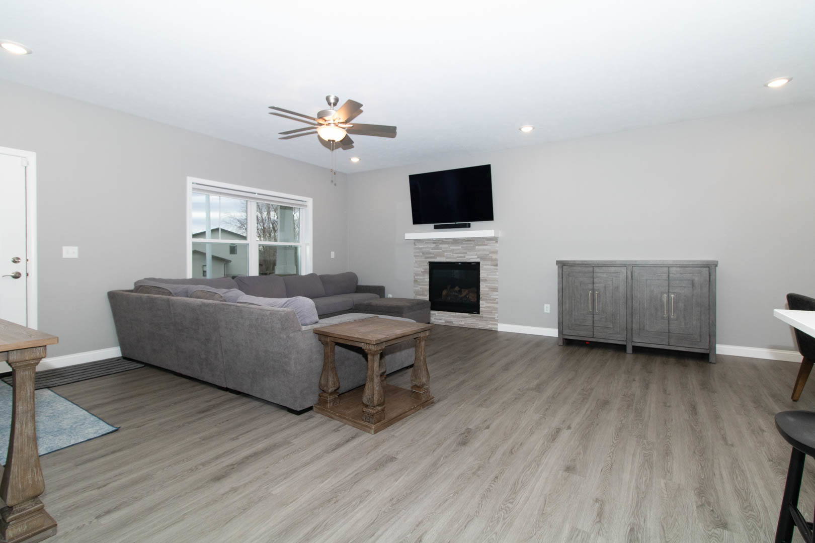 300 Raef Road Downs, IL 61736 - Photo 5 of 47 a living room with furniture and a flat screen tv