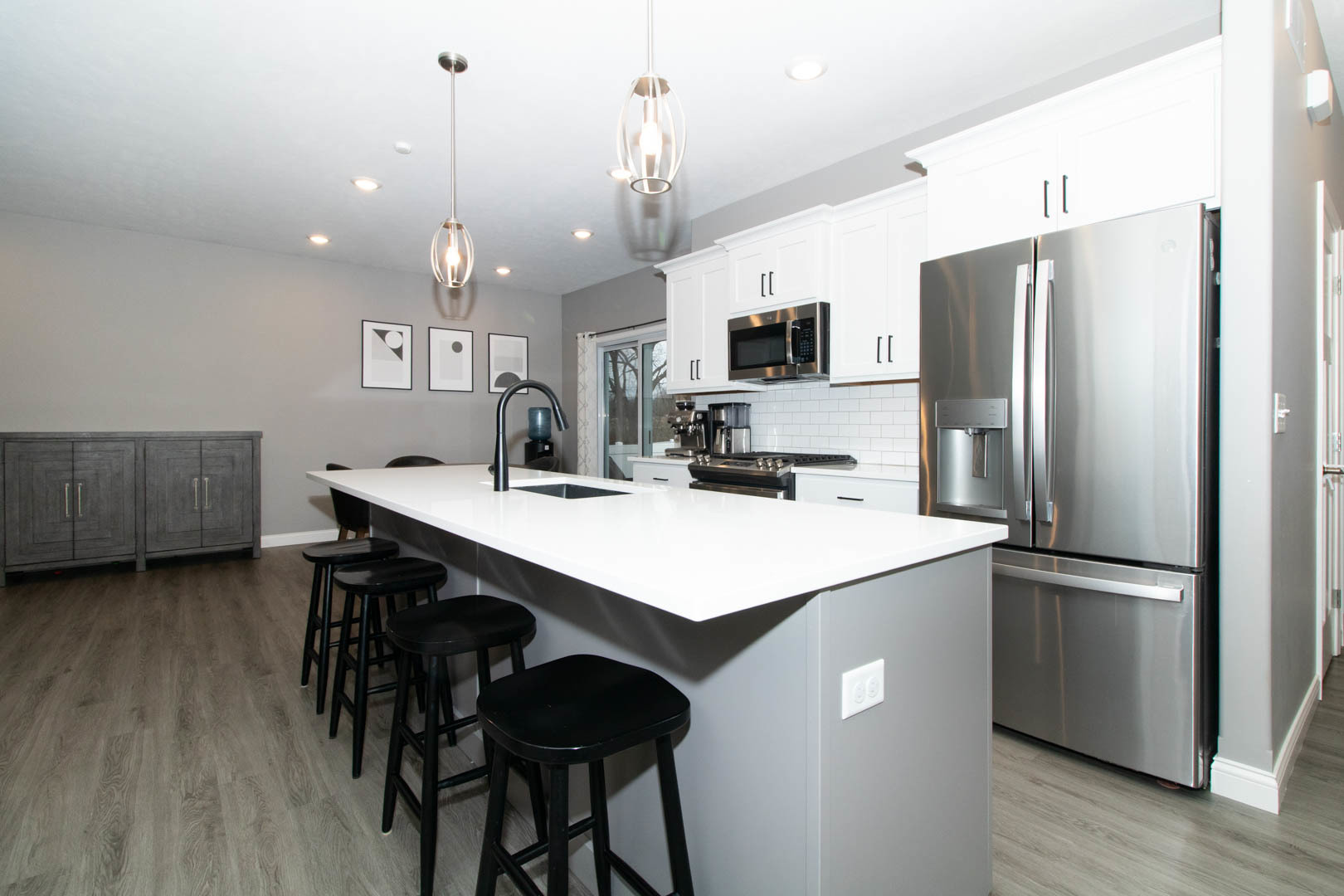300 Raef Road Downs, IL 61736 - Photo 9 of 47 a kitchen with kitchen island a sink appliances and cabinets