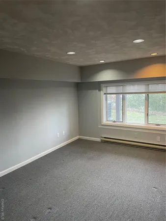 an empty room with a empty space and a window