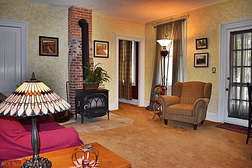 6670 Dunham Road Walton Hills, OH 44146 - Photo 4 of 35 Large and open Living Room with wood stove, so much charm...