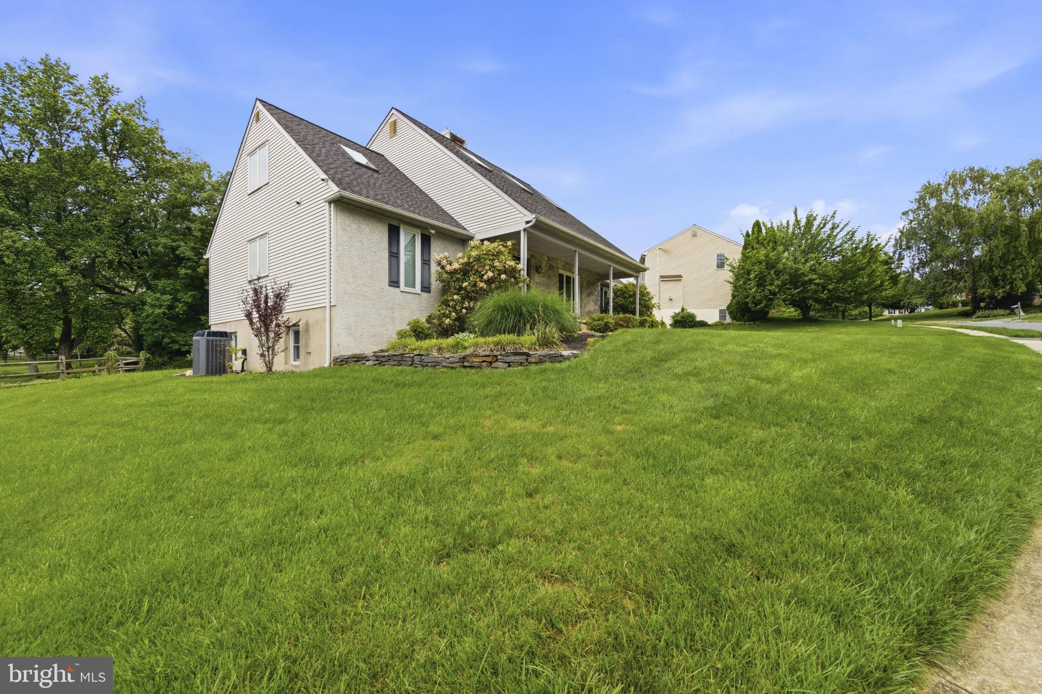 736 Letitia Drive Hockessin, DE 19707 - Photo 5 of 92 a front view of house with yard and green space