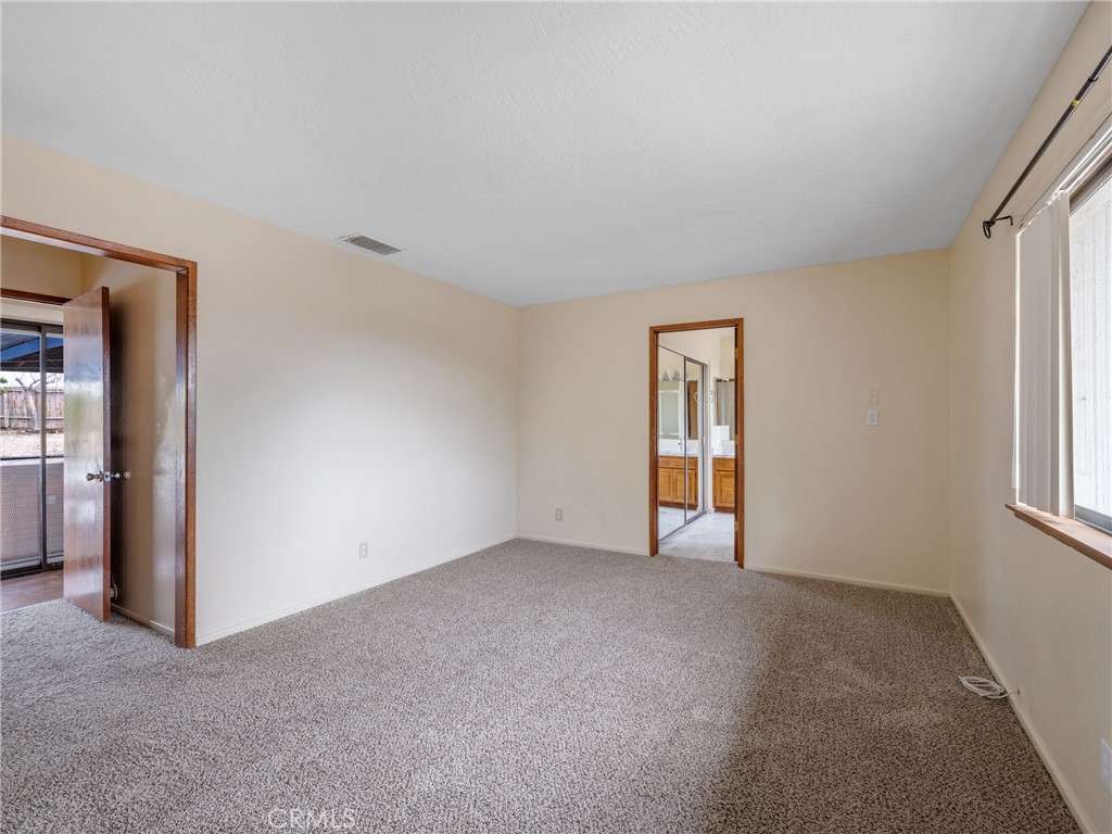 19236 Hupa Road Apple Valley, CA 92307 - Photo 21 of 44 a view of an empty room with a window