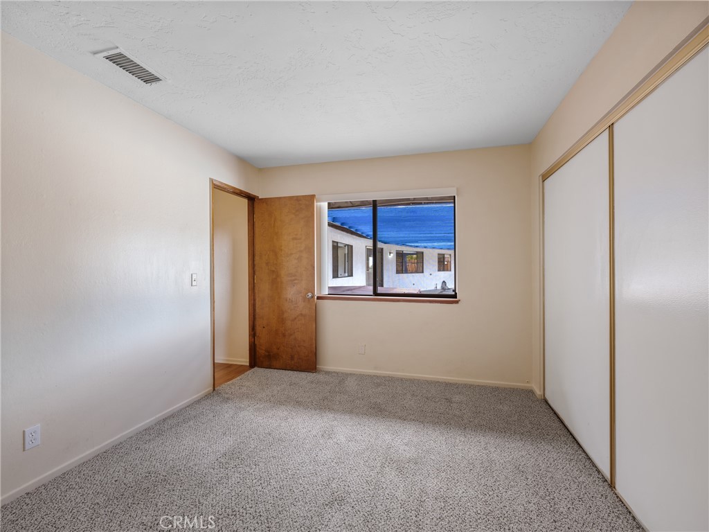 19236 Hupa Road Apple Valley, CA 92307 - Photo 27 of 44 a view of an empty room with a window
