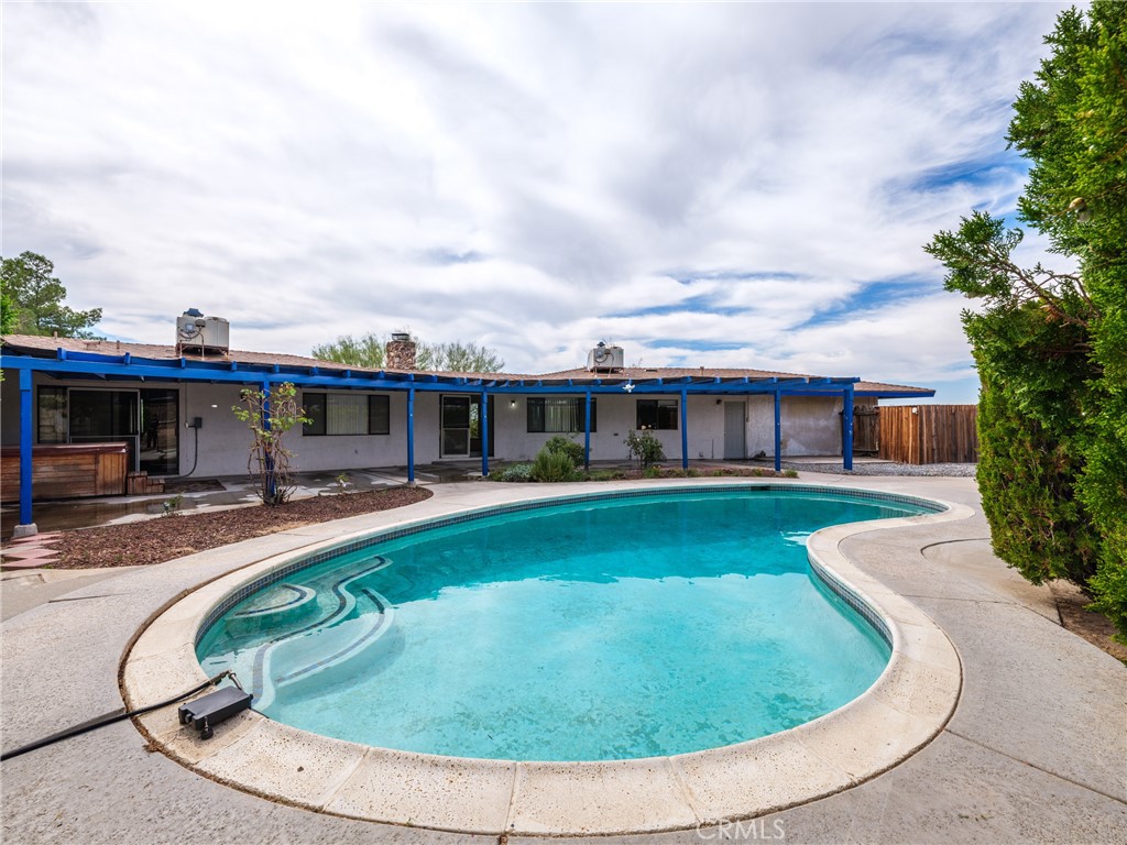 19236 Hupa Road Apple Valley, CA 92307 - Photo 6 of 44 a view of a house with swimming pool and porch