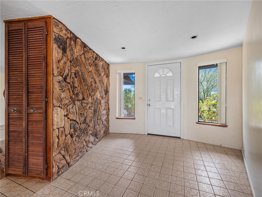 19236 Hupa Road Apple Valley, CA 92307 - Photo 8 of 44 a view of empty room with window and hardwood floor