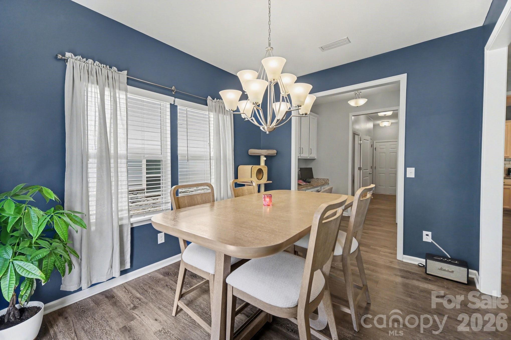 6423 Kinder Lane Lancaster, SC 29720 - Photo 12 of 48 a view of a dining room with furniture and a potted plant