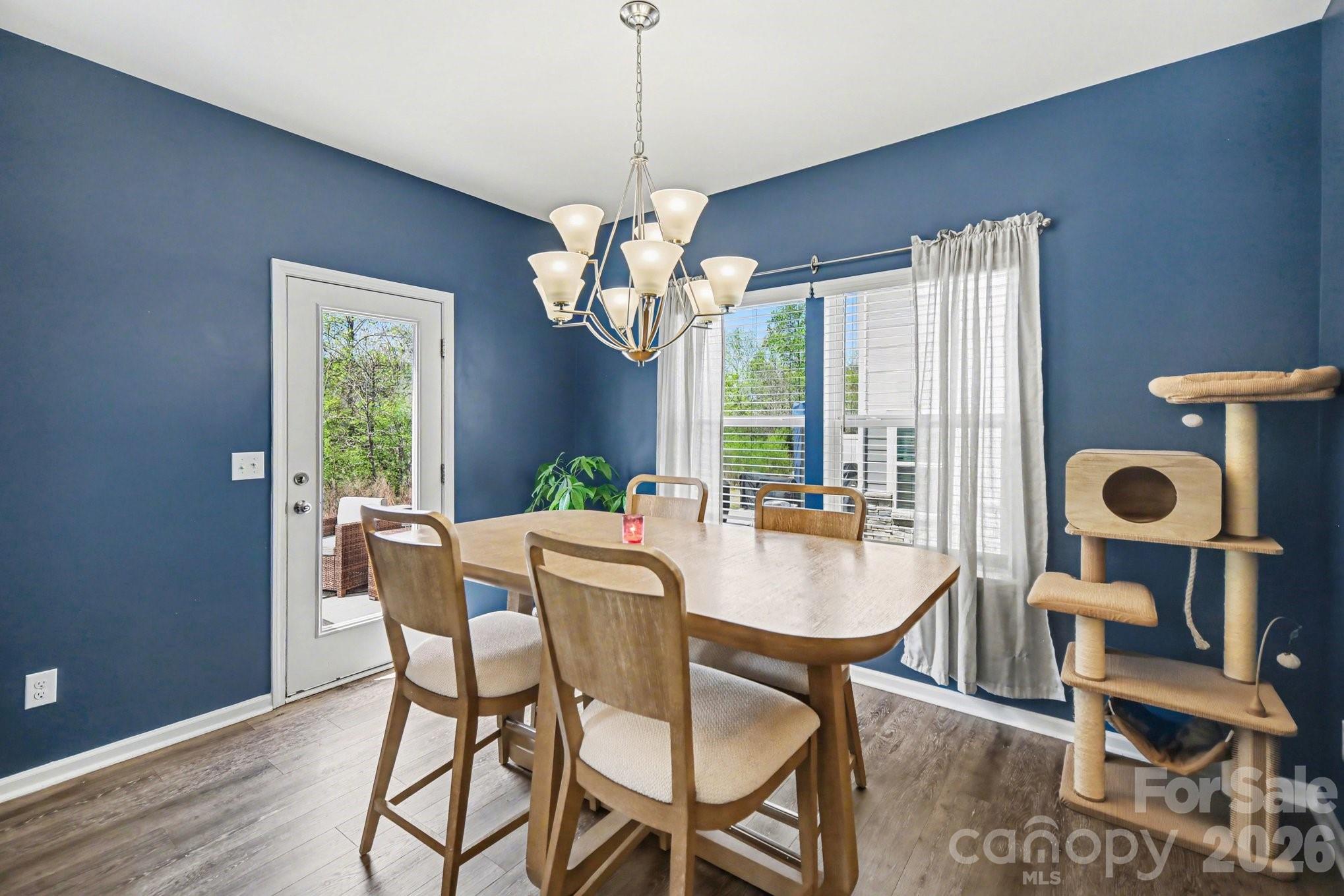 6423 Kinder Lane Lancaster, SC 29720 - Photo 15 of 48 a view of a dining room with furniture wooden floor and chandelier