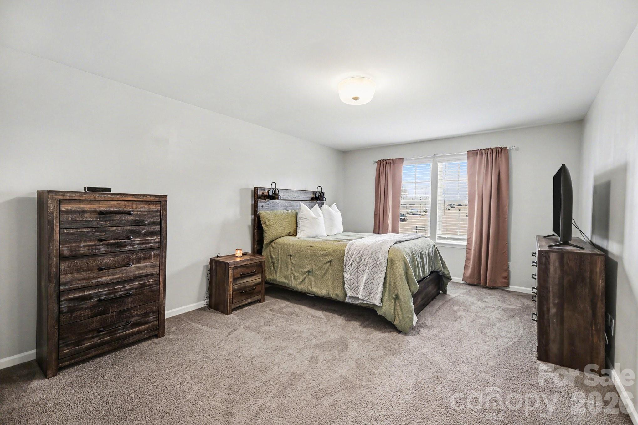 6423 Kinder Lane Lancaster, SC 29720 - Photo 25 of 48 a bedroom with a bed and dresser