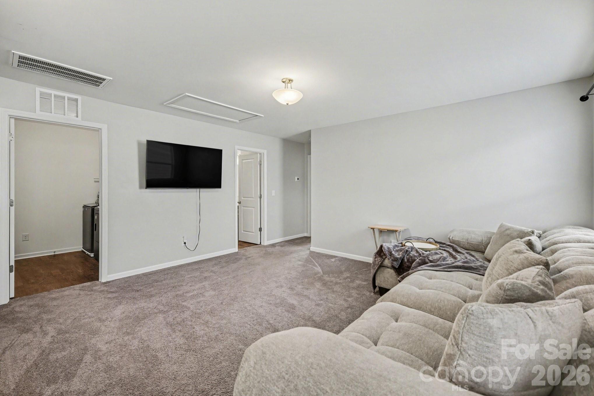 6423 Kinder Lane Lancaster, SC 29720 - Photo 32 of 48 a living room with furniture and a flat screen tv