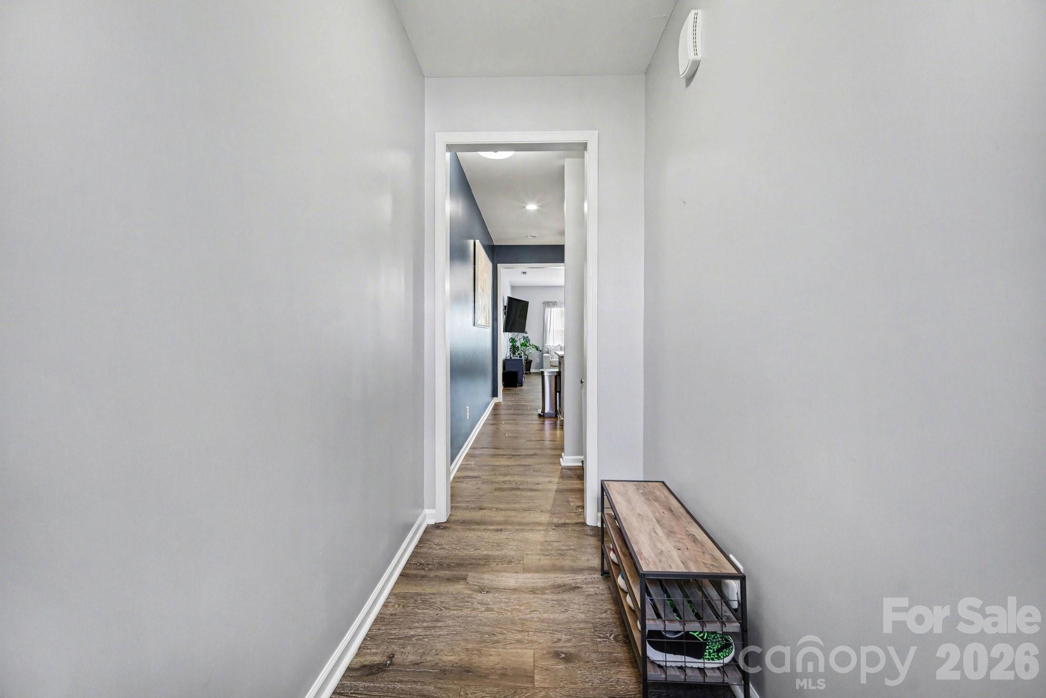 6423 Kinder Lane Lancaster, SC 29720 - Photo 4 of 48 a view of a hallway with wooden floor and staircase