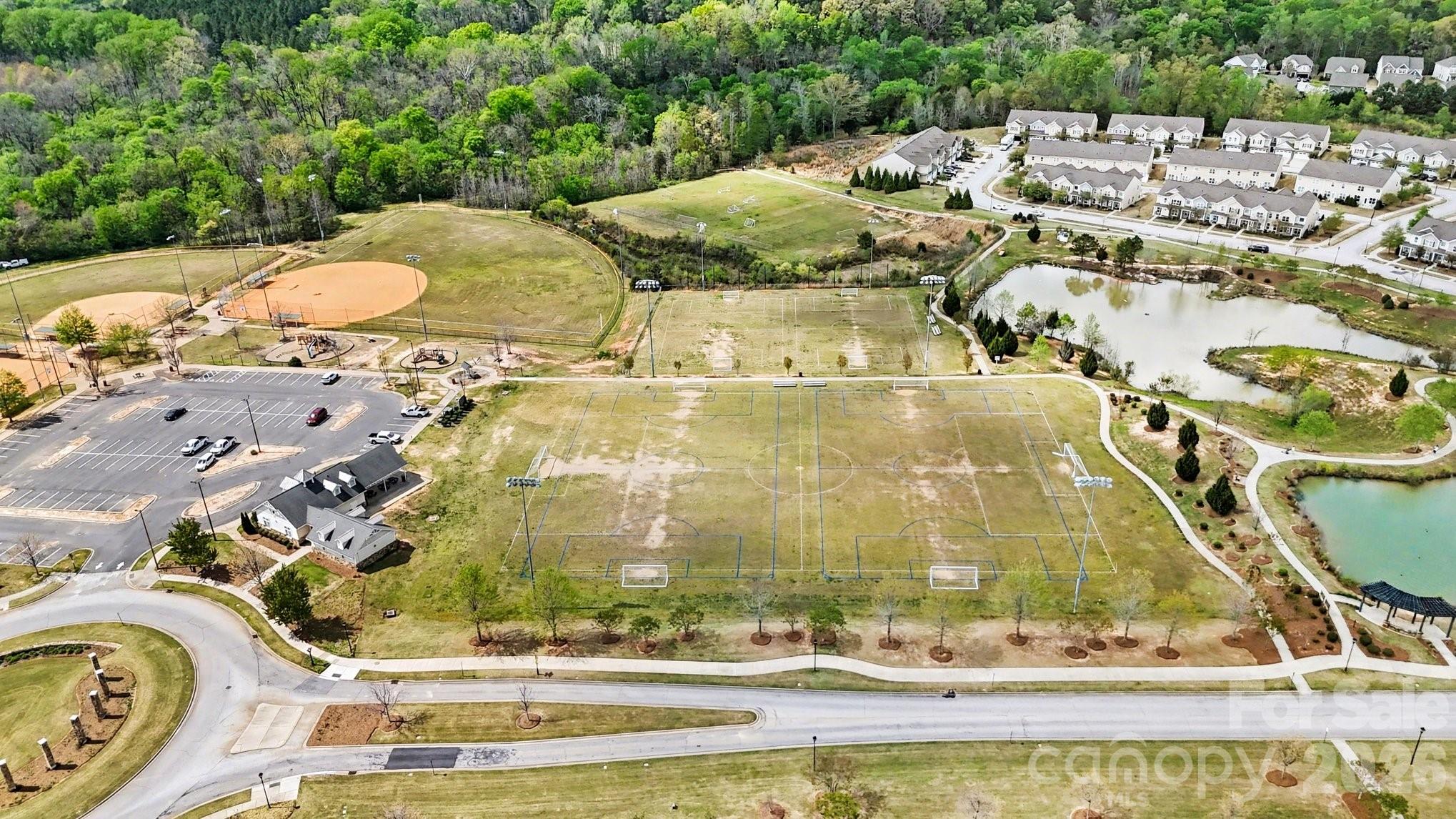 6423 Kinder Lane Lancaster, SC 29720 - Photo 41 of 48 a view of swimming pool with a yard and lake view in back