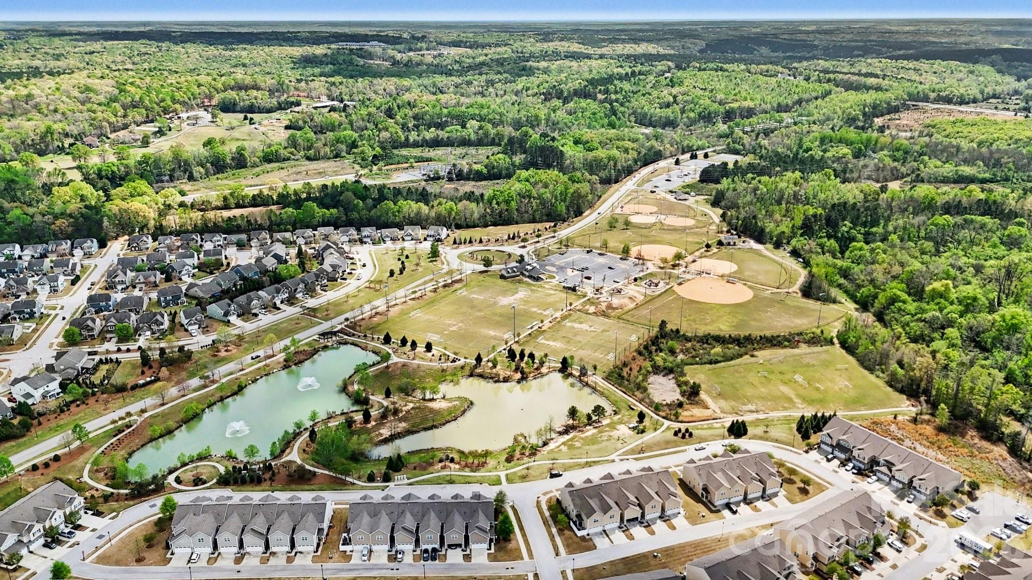 6423 Kinder Lane Lancaster, SC 29720 - Photo 45 of 48 a view of a swimming pool with a garden