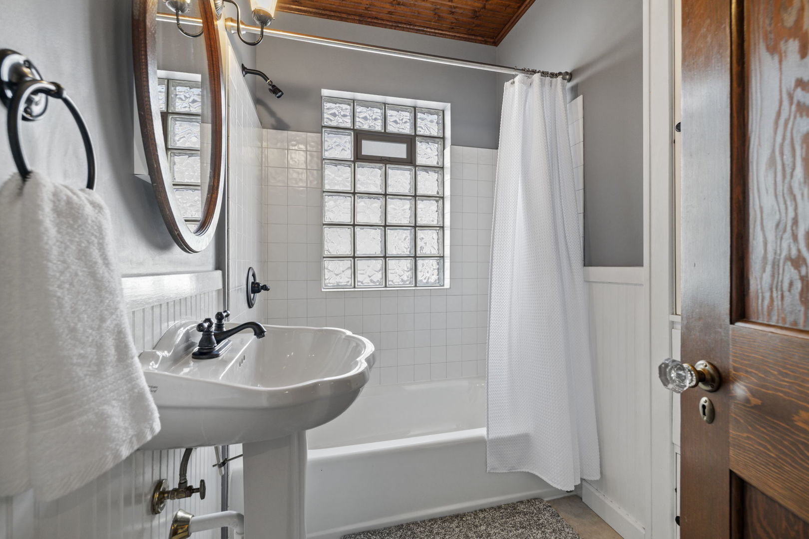 603 North Brainard Street Naperville, IL 60563 - Photo 31 of 44 a bathroom with a sink and a mirror