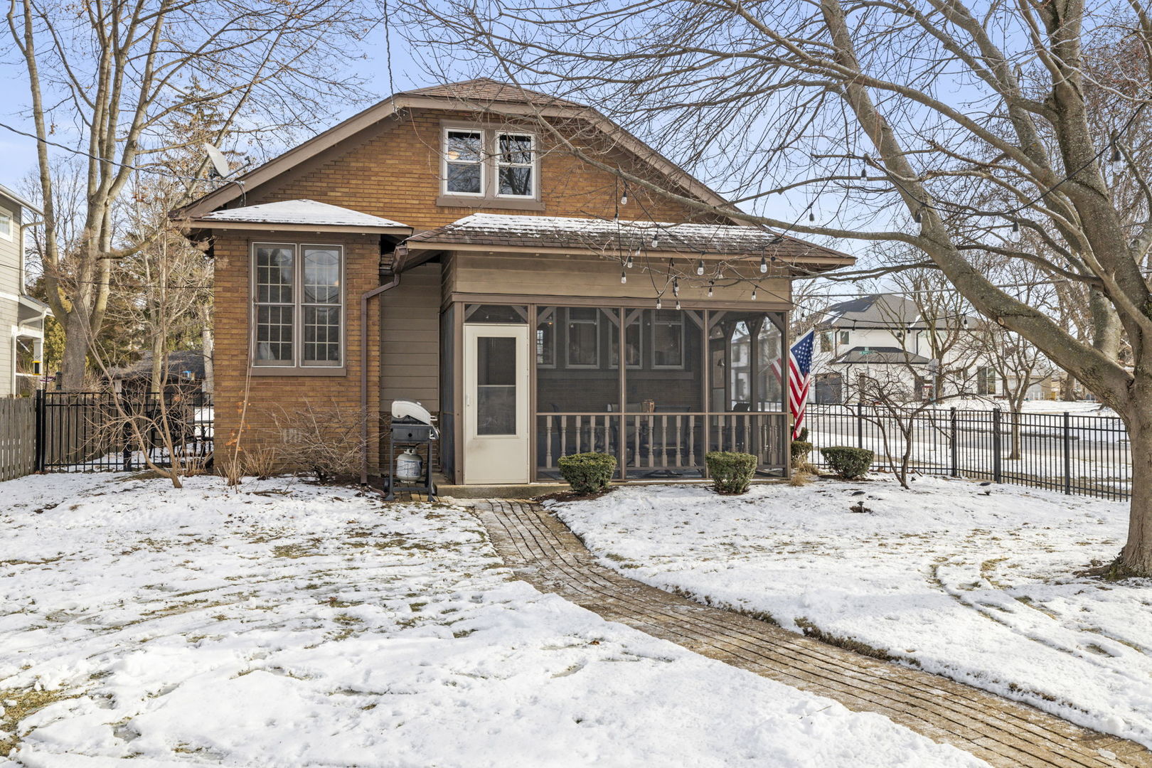 603 North Brainard Street Naperville, IL 60563 - Photo 5 of 44 a front view of a house with a yard covered in snow