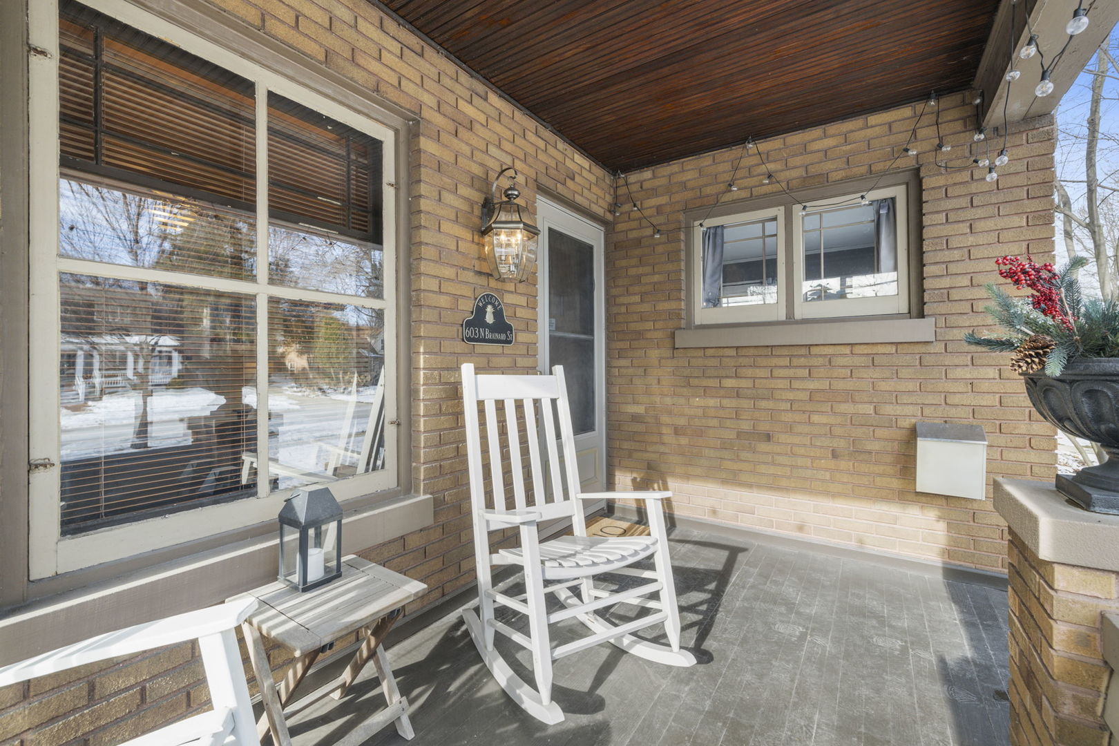 603 North Brainard Street Naperville, IL 60563 - Photo 10 of 44 a balcony with table and chairs and potted plants