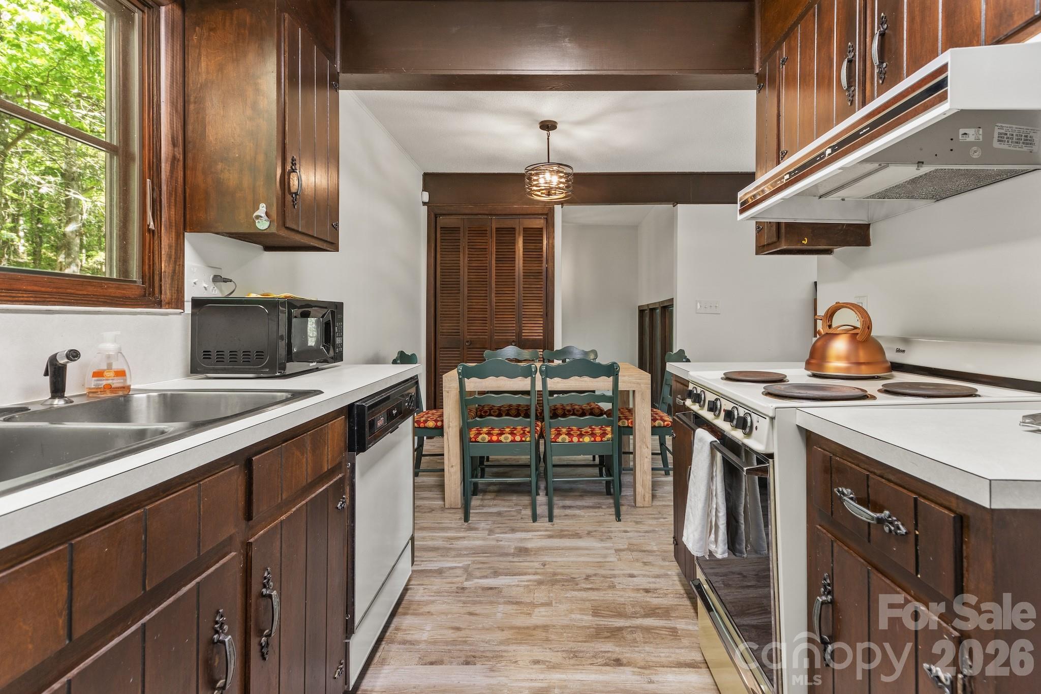 1971 Buffalo Creek Road Lake Lure, NC 28746 - Photo 12 of 31 a kitchen with a stove top oven sink and cabinets