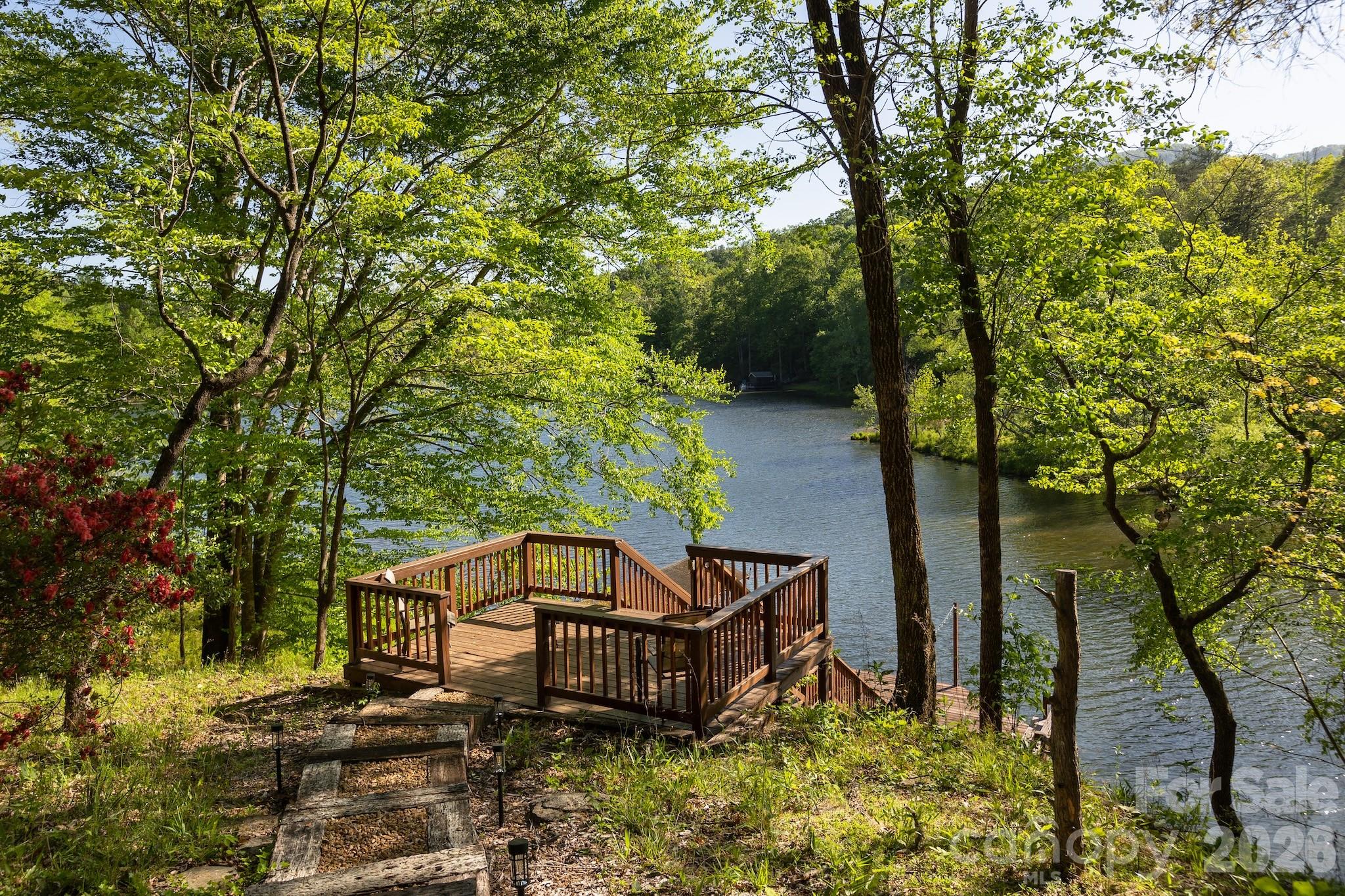 1971 Buffalo Creek Road Lake Lure, NC 28746 - Photo 2 of 31 a view of a two chairs in the garden