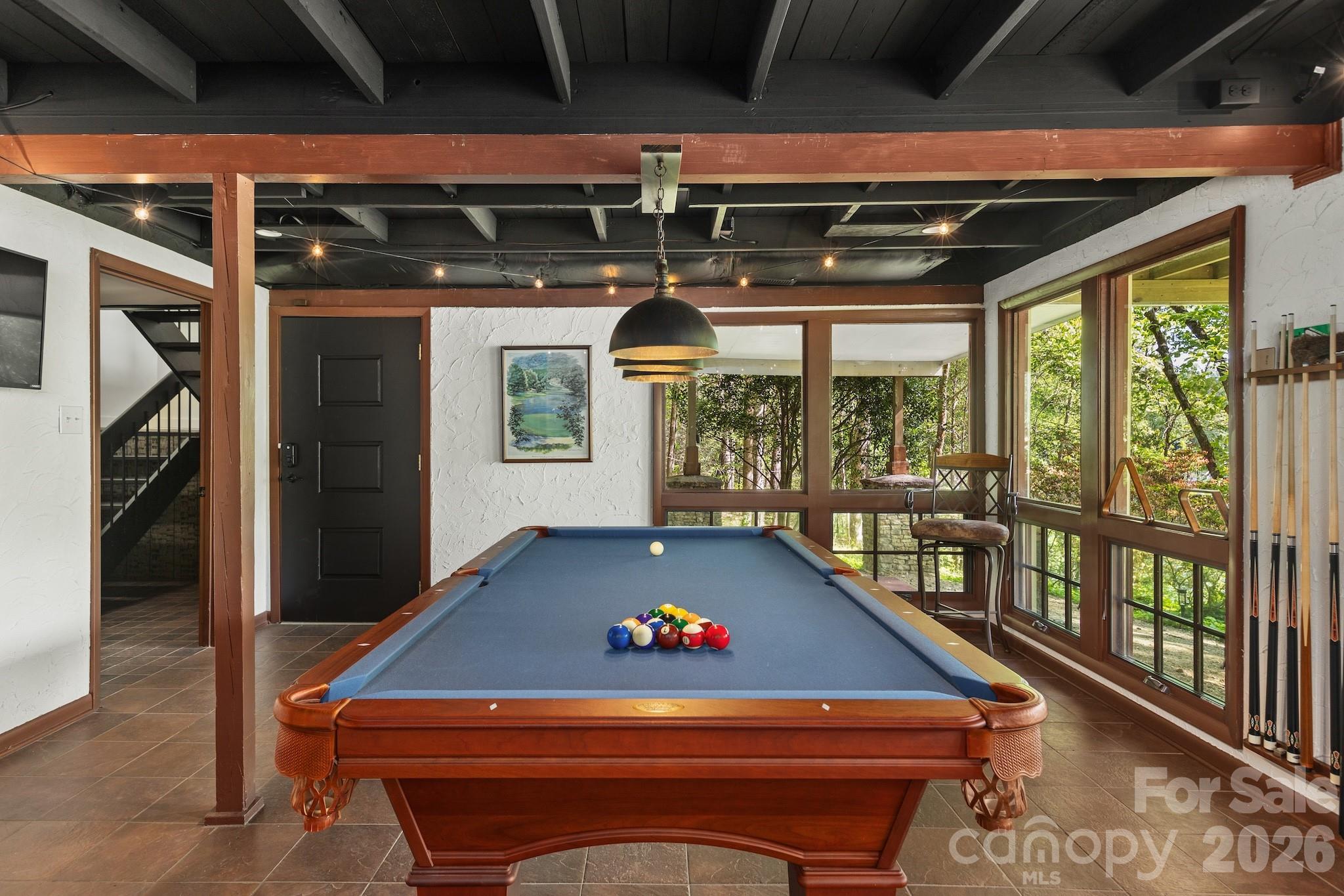 1971 Buffalo Creek Road Lake Lure, NC 28746 - Photo 21 of 31 a room with pool table and windows