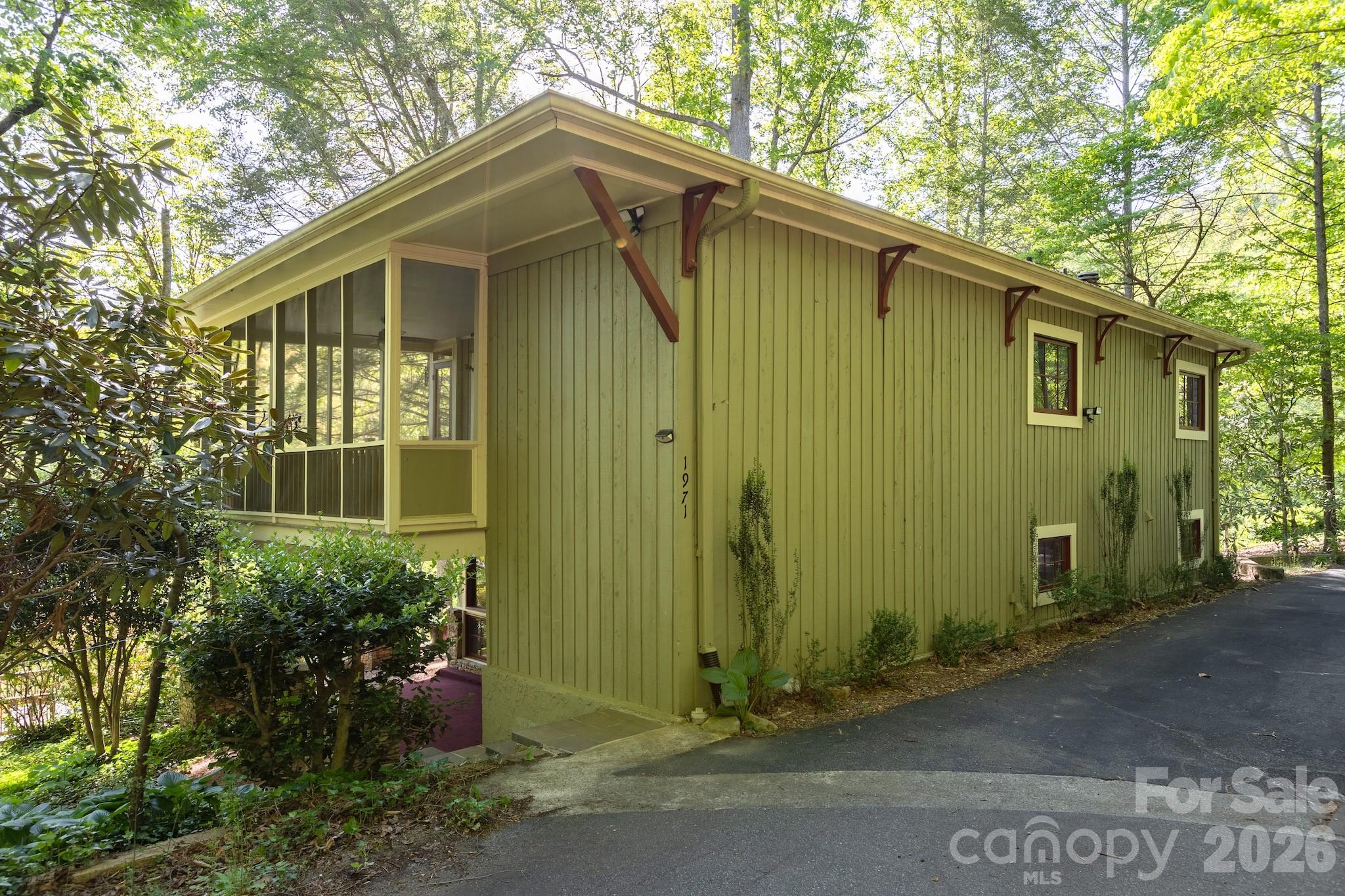 1971 Buffalo Creek Road Lake Lure, NC 28746 - Photo 25 of 31 a front view of a house with garden
