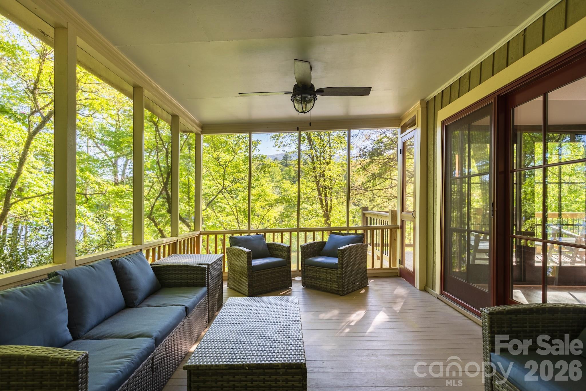 1971 Buffalo Creek Road Lake Lure, NC 28746 - Photo 4 of 31 a living room with furniture and a floor to ceiling window